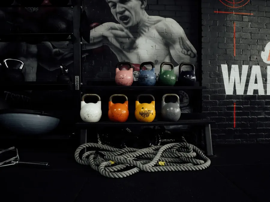 Kettlebells and battle ropes in the functional room at BoxCross UK