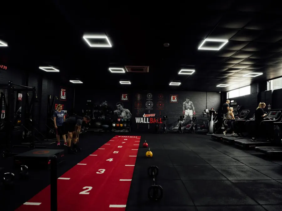 Members training on the red sled track in the functional room at BoxCross UK, Wisbech